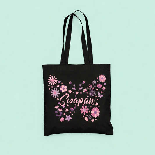 Black tote bag with pink floral design and 'Lipapan' text on a light blue background